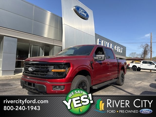 2026 Ford F-150 XLT in Ruby Red Metallic Tinted Clearcoat — front three-quarter view